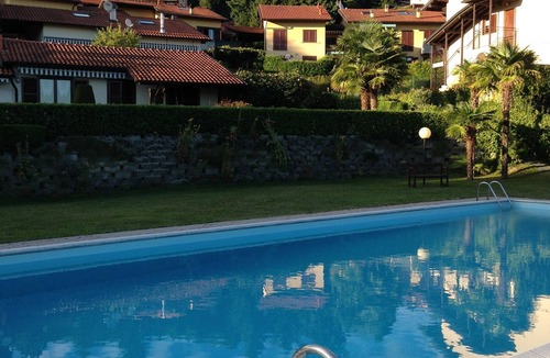 Agra Apartment | 3-room apartment with dream lake view in a residence with pool and sunbathing lawn