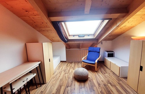 Villanuova sul Clisi Villa | Red villa with shared pool and private garden is the new black on Lake Garda