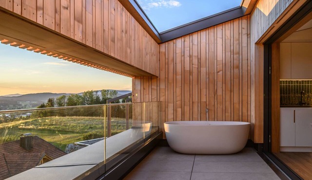Modern design apartment with a view of the valley. With sauna, roof terrace, outdoor bathtub and custom-made furnishings. Perfect for two adults who appreciate peace and quality.